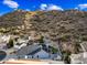 An aerial view of the home and neighborhood backing up to the hills at 1723 E Behrend Dr, Phoenix, AZ 85024