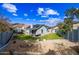 Expansive backyard with manicured lawn, desert landscaping, hot tub, and inviting outdoor seating area at 1723 E Behrend Dr, Phoenix, AZ 85024