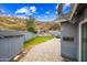 Backyard space with outdoor seating, desert landscaping, and mountain views, creating a serene outdoor oasis at 1723 E Behrend Dr, Phoenix, AZ 85024