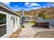 Backyard patio featuring a hot tub, outdoor seating area, and easy access to the home's outdoor space at 1723 E Behrend Dr, Phoenix, AZ 85024