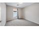 Bright bedroom featuring carpeted floors and a window that allows natural light to fill the space, creating a serene atmosphere at 1723 E Behrend Dr, Phoenix, AZ 85024