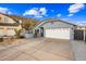 Charming home with a two-car garage, desert landscaping, and mountain views at 1723 E Behrend Dr, Phoenix, AZ 85024