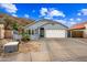 Charming single-story home with a two-car garage, well-maintained front yard, and inviting curb appeal at 1723 E Behrend Dr, Phoenix, AZ 85024