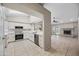 Modern kitchen with white cabinets, a skylight, stainless steel appliances, and ample countertop space at 1723 E Behrend Dr, Phoenix, AZ 85024