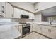 Updated kitchen featuring stainless steel appliances and ample counter space at 1723 E Behrend Dr, Phoenix, AZ 85024