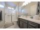 Well-lit bathroom featuring modern fixtures, a glass-enclosed shower, and a stylish vanity at 17878 W Amber Ridge Way, Goodyear, AZ 85338