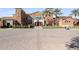 Exterior view of the community Village Center with covered entrance and inviting landscaping at 17878 W Amber Ridge Way, Goodyear, AZ 85338