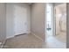 Welcoming entryway featuring tile flooring and a clear view into the bedroom and bathroom at 17878 W Amber Ridge Way, Goodyear, AZ 85338