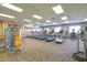 Bright community gym featuring cardio equipment, weight machines, and a mirrored wall at 17878 W Amber Ridge Way, Goodyear, AZ 85338