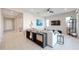 Open-concept living room with tile floors and a console table for decor at 17878 W Amber Ridge Way, Goodyear, AZ 85338