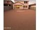 Spacious backyard ready for landscaping, with covered patio and block fence for privacy at 18243 W Larkspur Dr, Goodyear, AZ 85338