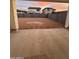 Spacious backyard with dirt ground and a block wall fence for privacy at 18243 W Larkspur Dr, Goodyear, AZ 85338