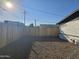 Gravel-covered backyard with a new wooden fence providing privacy, creating a low-maintenance outdoor area at 1835 E Atlanta Ave, Phoenix, AZ 85040