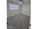 Bedroom featuring new carpeting, fresh paint, a ceiling fan and a window for natural light at 1835 E Atlanta Ave, Phoenix, AZ 85040