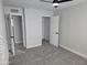 Bedroom featuring fresh paint, new carpet, two closets and a ceiling fan at 1835 E Atlanta Ave, Phoenix, AZ 85040