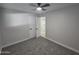 Bedroom with fresh paint, new carpet, closet, and ceiling fan at 1835 E Atlanta Ave, Phoenix, AZ 85040