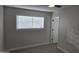 Bedroom featuring new carpet, a window with blinds, and neutral paint at 1835 E Atlanta Ave, Phoenix, AZ 85040