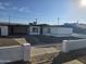 Charming single-story home with white exterior, contrasted by a well-maintained front yard with a white decorative fence at 1835 E Atlanta Ave, Phoenix, AZ 85040