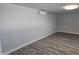 View of a room featuring vinyl floors, an air conditioning unit, and neutral paint at 1835 E Atlanta Ave, Phoenix, AZ 85040