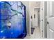 Bathroom featuring a patterned shower curtain and view of an adjacent hallway at 19806 W San Miguel Ave, Litchfield Park, AZ 85340