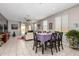 Bright dining area with tile floors, neutral walls, large windows, and a modern ceiling fan at 19806 W San Miguel Ave, Litchfield Park, AZ 85340