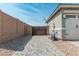 Paver driveway leads to a private gate next to the home's garage at 19806 W San Miguel Ave, Litchfield Park, AZ 85340