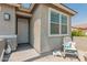 Inviting home with a decorative security door, rocking chair and a well-kept front porch at 19806 W San Miguel Ave, Litchfield Park, AZ 85340