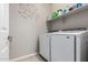 Well-organized laundry room with modern appliances and a clean, functional design at 19806 W San Miguel Ave, Litchfield Park, AZ 85340