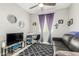 Living room featuring a ceiling fan, desk, sofa, shag rug, and a TV at 19806 W San Miguel Ave, Litchfield Park, AZ 85340