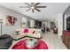 Open living room featuring modern decor, tile floors, and a neutral color palette with pops of color at 19806 W San Miguel Ave, Litchfield Park, AZ 85340