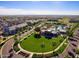 Scenic aerial view of the community showcasing the neighborhood, parks, pool, and manicured landscaping at 19982 W Glenrosa Ave, Litchfield Park, AZ 85340