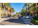 View of storefronts lined with palm trees in the community at 19982 W Glenrosa Ave, Litchfield Park, AZ 85340