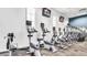 Well-equipped fitness center with cardio machines and mounted televisions at 19982 W Glenrosa Ave, Litchfield Park, AZ 85340