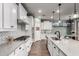 Well-designed kitchen featuring modern appliances, white cabinets, and a contrasting backsplash at 19982 W Glenrosa Ave, Litchfield Park, AZ 85340