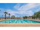 Beautiful outdoor swimming pool featuring lane markers, lounge chairs, and a sunny spot for relaxation at 19982 W Glenrosa Ave, Litchfield Park, AZ 85340