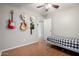 Bright bedroom with stylish guitar-themed decor at 200 E Hess Ave, Coolidge, AZ 85128