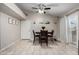 Cozy dining room with tile floors, a table for four, and sliding glass doors to the backyard at 200 E Hess Ave, Coolidge, AZ 85128