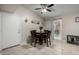 Cozy dining room with tile floors, a table for four, and sliding glass doors to the backyard at 200 E Hess Ave, Coolidge, AZ 85128