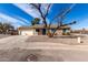 Charming single-story home with a low maintenance yard and attached two-car garage at 200 E Hess Ave, Coolidge, AZ 85128