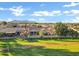 Aerial view of the property backing on a green space with beautiful mountain views at 20391 N Sunrise Ln, Maricopa, AZ 85138