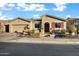 Charming home featuring desert landscaping, a paver driveway, and warm neutral colors at 20391 N Sunrise Ln, Maricopa, AZ 85138