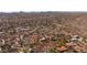 An aerial view of a desert landscape showcases a home outlined in red at 2070 W Bromm Ln, Wickenburg, AZ 85390