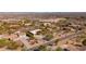 Aerial view of multiple homes in an arid landscape with mountain views at 2070 W Bromm Ln, Wickenburg, AZ 85390