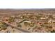 A desert landscape with multiple houses scattered among the desert vegetation at 2070 W Bromm Ln, Wickenburg, AZ 85390