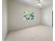 Neutral bedroom with carpet, a ceiling fan, and large window at 2070 W Bromm Ln, Wickenburg, AZ 85390