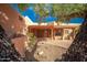 Charming courtyard with stone accents and a covered patio offers a serene outdoor space at 2070 W Bromm Ln, Wickenburg, AZ 85390