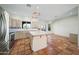 Bright kitchen with an island, stainless steel appliances and Saltillo tile flooring at 2070 W Bromm Ln, Wickenburg, AZ 85390