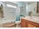 Well-lit bathroom features a tub, a toilet, and a vanity sink at 214 N 222Nd Dr, Buckeye, AZ 85326