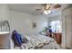 Cozy bedroom with a decorative bed frame and blue accent pillows at 214 N 222Nd Dr, Buckeye, AZ 85326