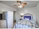 Comfortable bedroom featuring a ceiling fan and a rustic metal bed frame at 214 N 222Nd Dr, Buckeye, AZ 85326